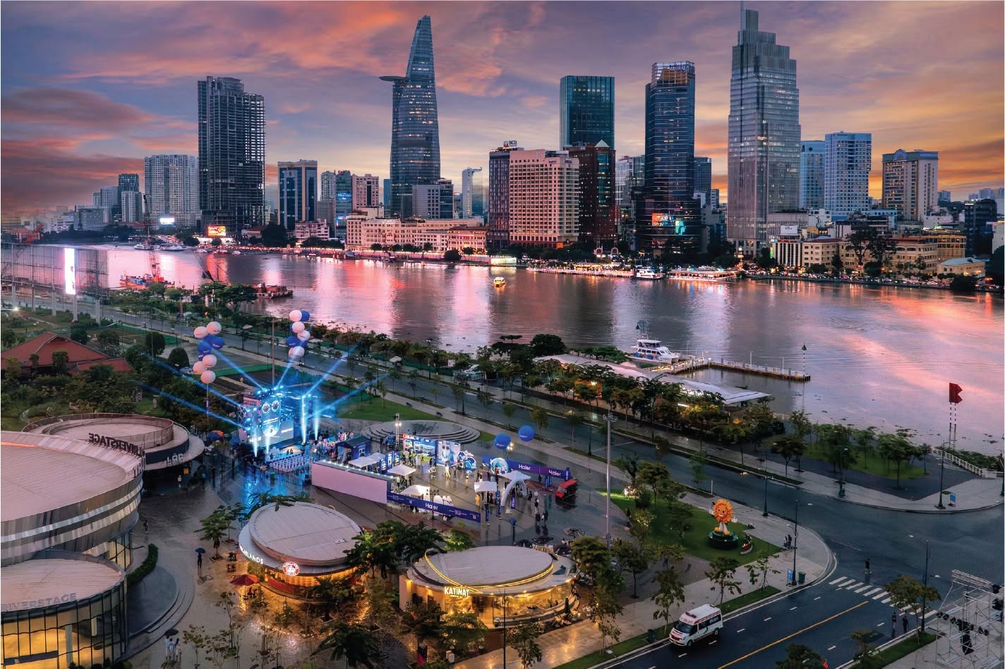 Dusk panorama of the Saigon River looking toward the illuminated District 1 skyline